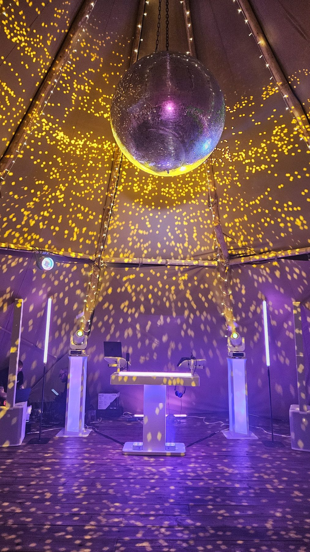 Mirror ball and fairy lights above a wedding dance floor